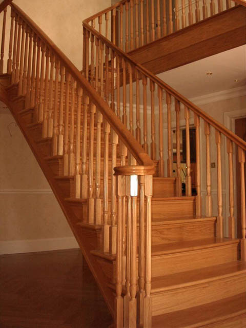 A photograph of an Applewood Joinery Ltd Spindle and mitred staircase.