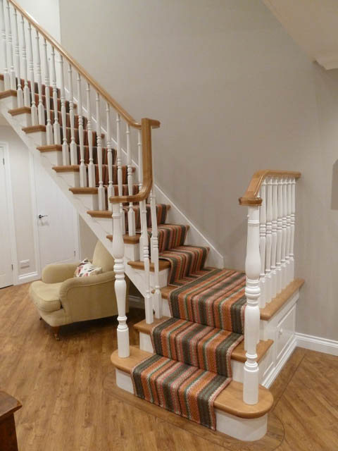 A photograph of an Applewood Joinery Ltd Spindle and mitred staircase.