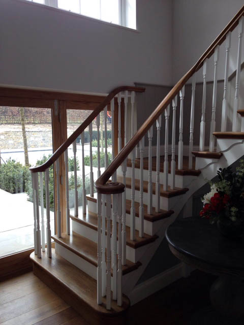 A photograph of an Applewood Joinery Ltd Spindle and mitred staircase.